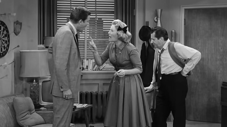 The Dick Van Dyke Show's Sally pointing her finger at Rob while Buddy stands off to the side