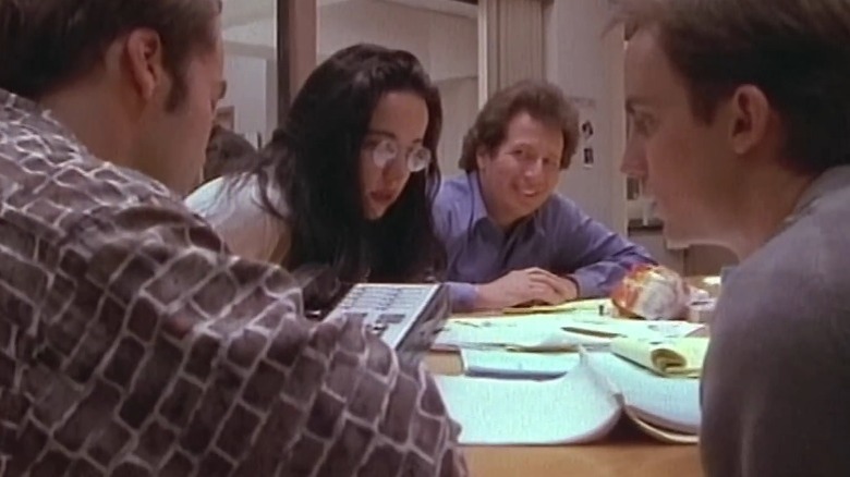 The Larry Sanders Show's Jerry, Paula, Larry, and Phil sitting around a telephone on a table