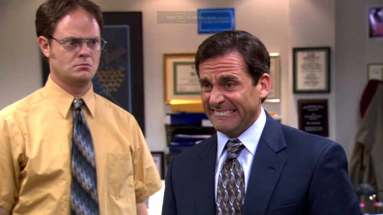 Stave Carell as Michael looking comically concerned and biting his lip in The Office