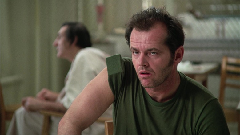 McMurphy raises his eyebrows in One Flew Over the Cuckoo's Nest