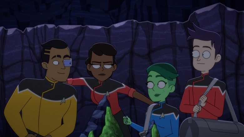 Rutherford, Mariner, Tendi, and Boimler all sit in the dark of a cave in Star Trek: Lower Decks