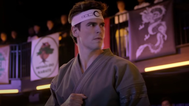 Patrick Luwis as Axel Kovačević wearing a captain's band on Cobra Kai