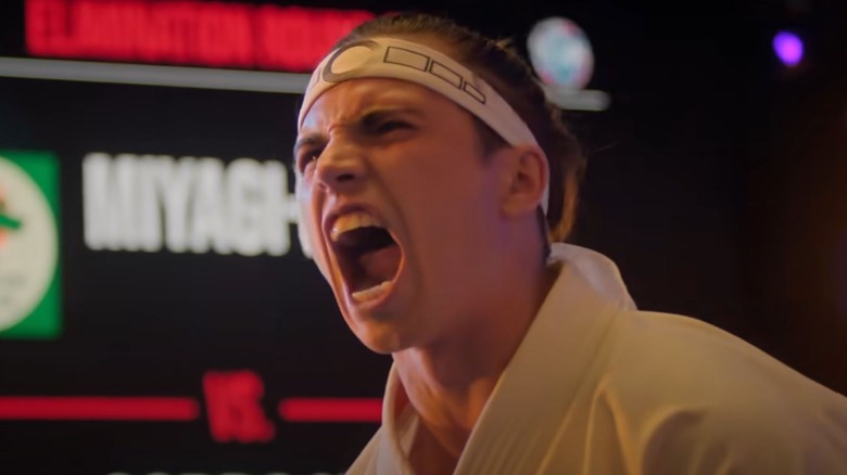 Tanner Buchanan as Robby Keene screaming on Cobra Kai