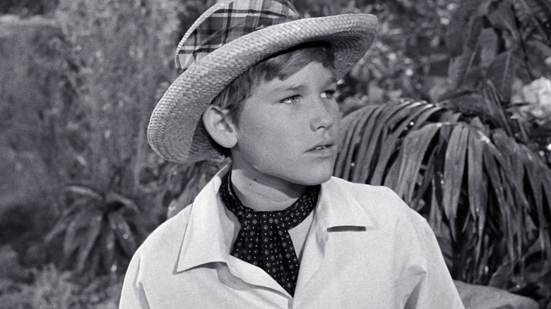 Kurt Russell seeks the help of the castaways as Jungle Boy in Gilligan's Island