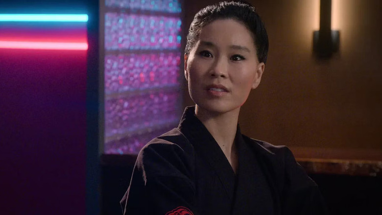 C.S. Lee as Kim Da-Eun wearing a black gi on Cobra Kai