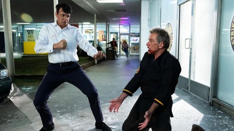 Ralph Macchio's Daniel LaRusso fighting Marrin Kove's John Kreese on Cobra Kai