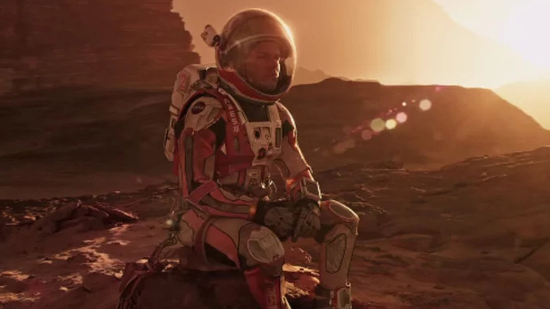 Matt Damon as Mark Watney sitting on Mars in The Martian