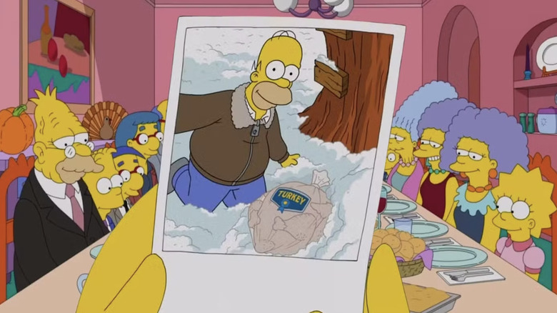 The Simpsons family gathered around the dinner table with a photo of Homer next to a frozen Turkey for Thanksgiving in The Simpsons