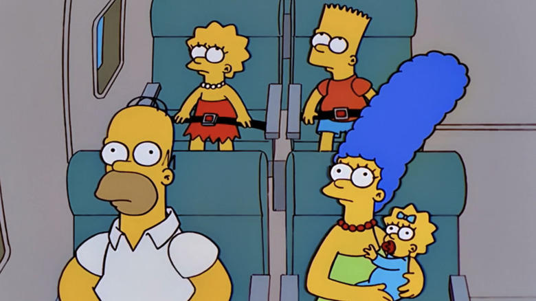 The Simpsons family sits on a plane in The Simpsons