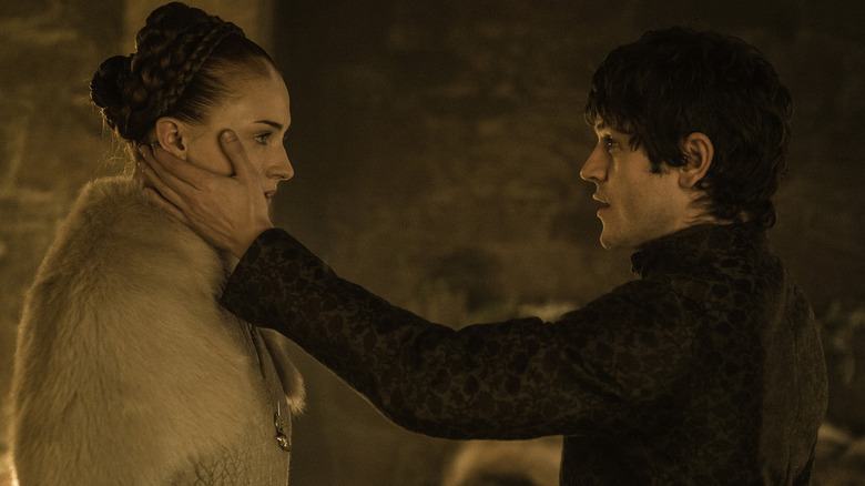 Ramsay Bolton with his hand on Sansa Stark's face in Game of Thrones