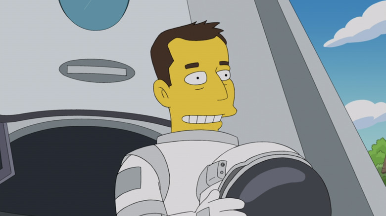 Elon Musk stands outside his spaceship holding his helmet in The Simpsons