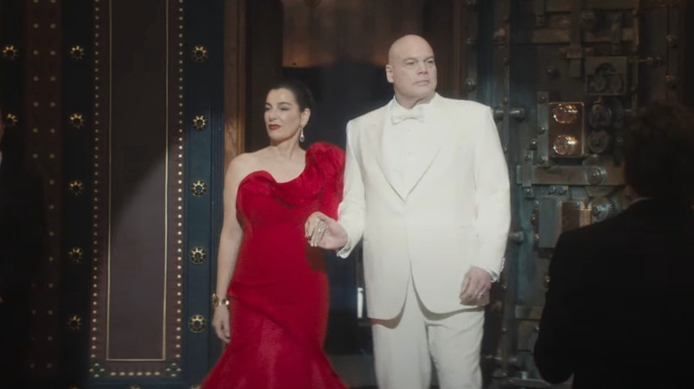 Wilson Fisk and Vanessa Fisk with a spotlight shining on them as they enter a fancy establishment