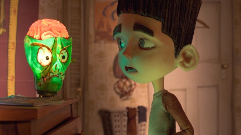 Norman looks past his zombie brain lamp in ParaNorman