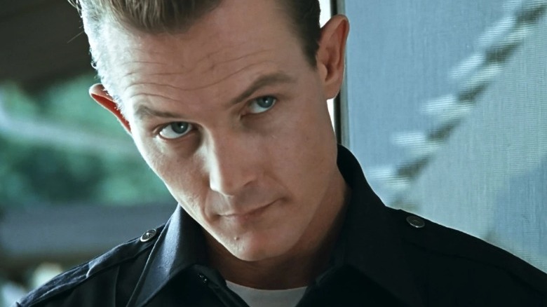 The T-1000 questions John's adoptive family.