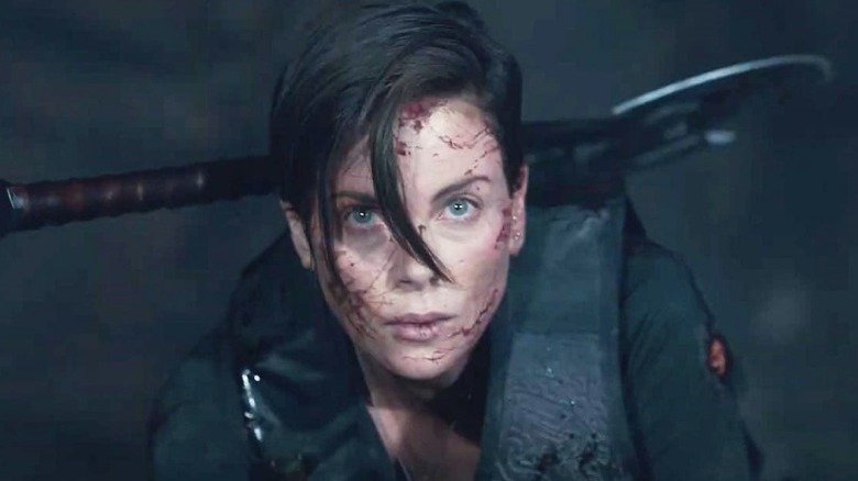 Charlize Theron is bloodied from battle in The Old Guard