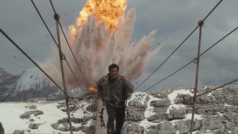 Sylvester Stallone outrunning an explosion on a rope bridge