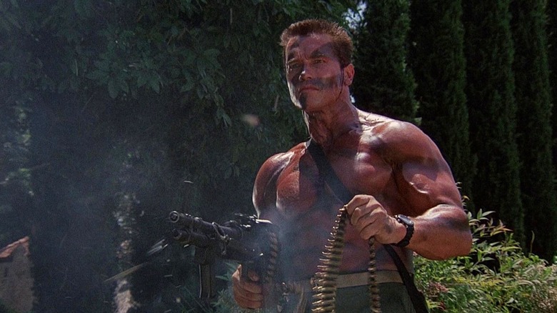 Arnold Schwarzenegger blasting a belt-fed machine gun