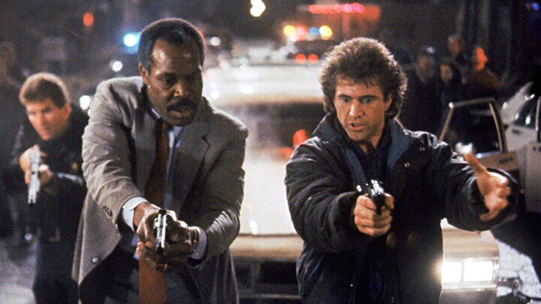 Danny Glover and Mel Gibson leading a bust