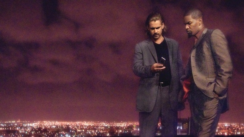 Colin Farrell and Jamie Foxx against the purple night sky