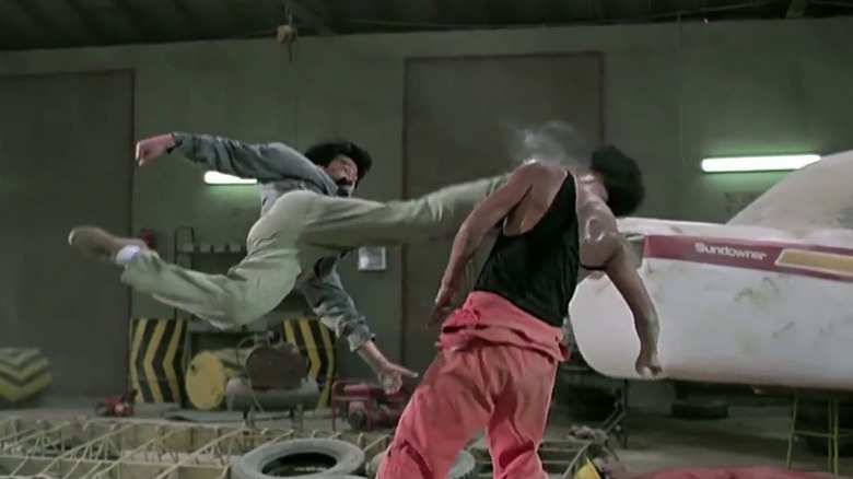 Yuen Biao jump-kicking Melvin Wong in a hangar