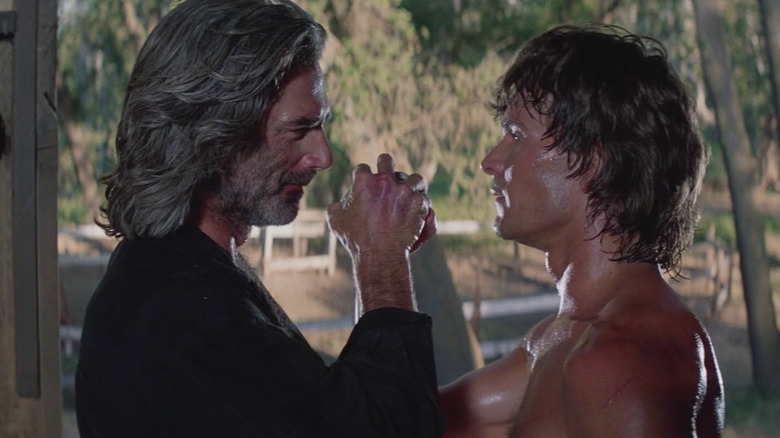 Sam Elliott and Patrick Swayze lock arms