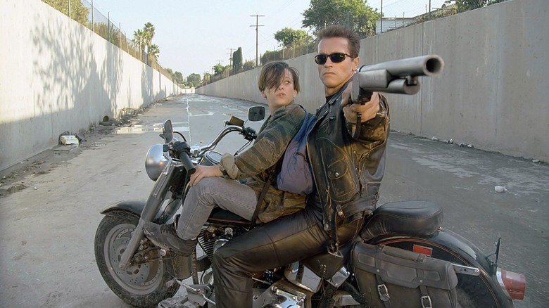 Edward Furlong and Arnold Schwarzenegger on a motorcycle