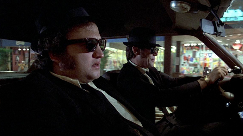 John Belushi and Dan Aykroyd speeding through a mall