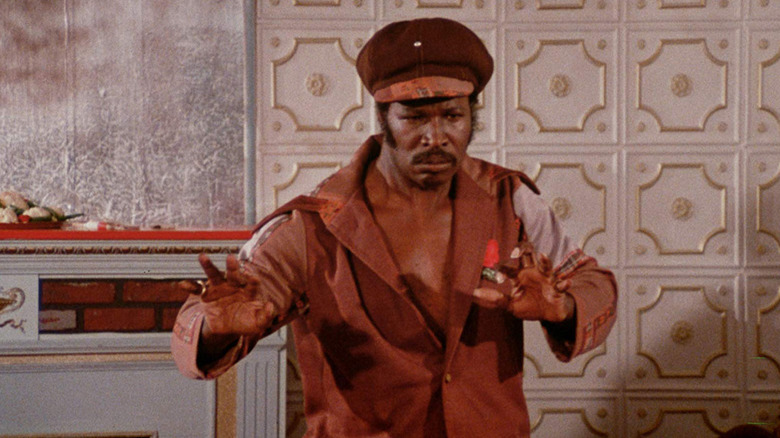 Rudy Ray Moore striking a fighting stance