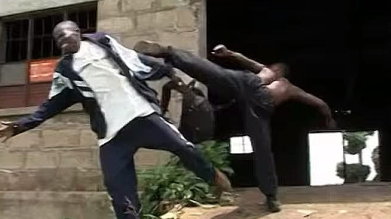 Bukenya Charles taking a roundhouse kick