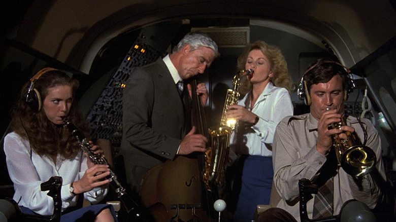 Airplane cast playing instruments in the cockpit