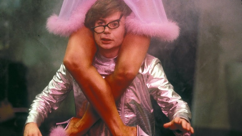 Austin Powers with woman on shoulders