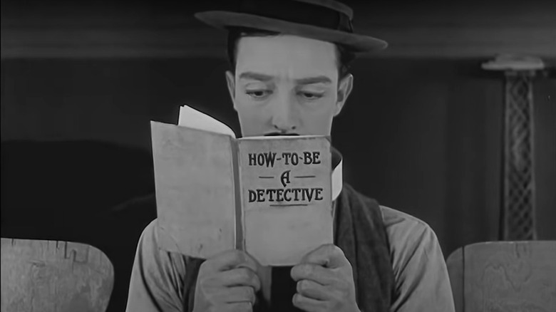 Buster Keaton reading self help book