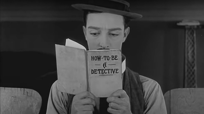 Buster Keaton reading self help book