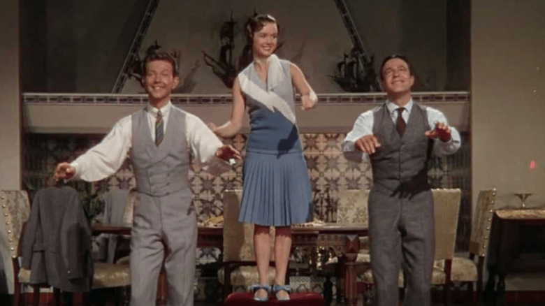 Donald O'Connor, Debbie Reynolds, and Gene Kelly dancing