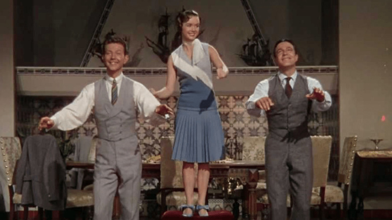 Donald O'Connor, Debbie Reynolds, and Gene Kelly dancing