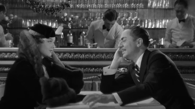 William Powell and Myrna Loy at restaurant