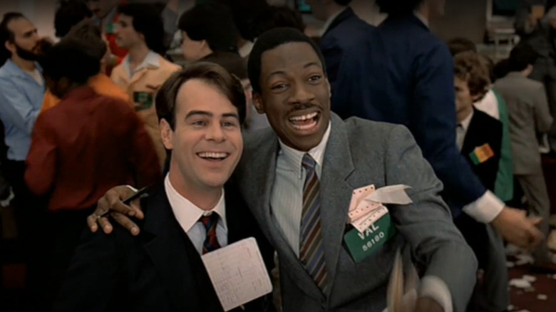 Aykroyd Murphy grinning at stock exchange