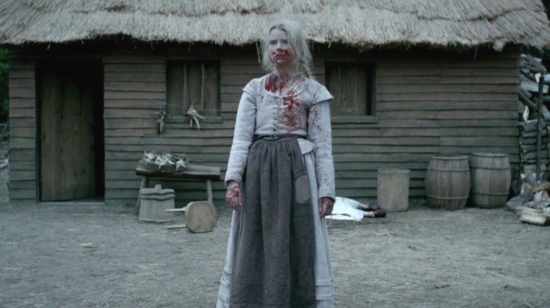 Anna Taylor Joy covered in blood in The Witch
