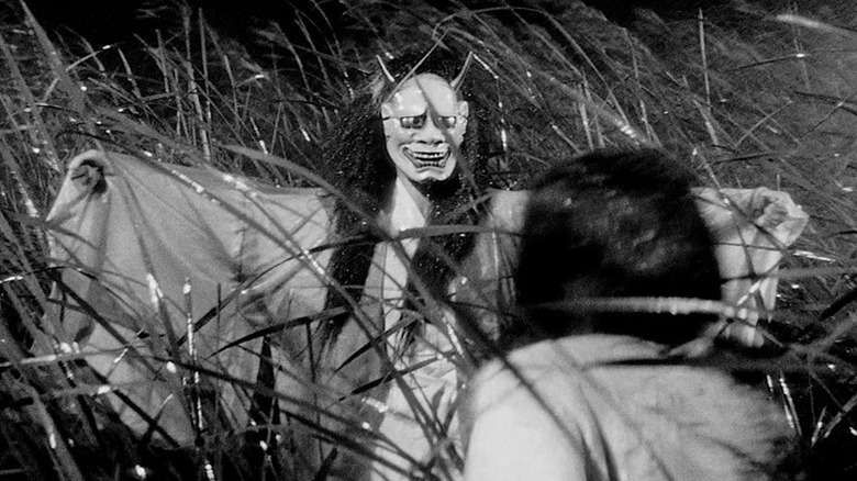 Woman in demon mask scares lady in Onibaba