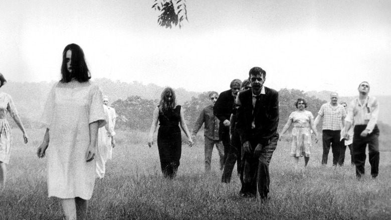 Zombies shamble across field in Night of the Living Dead
