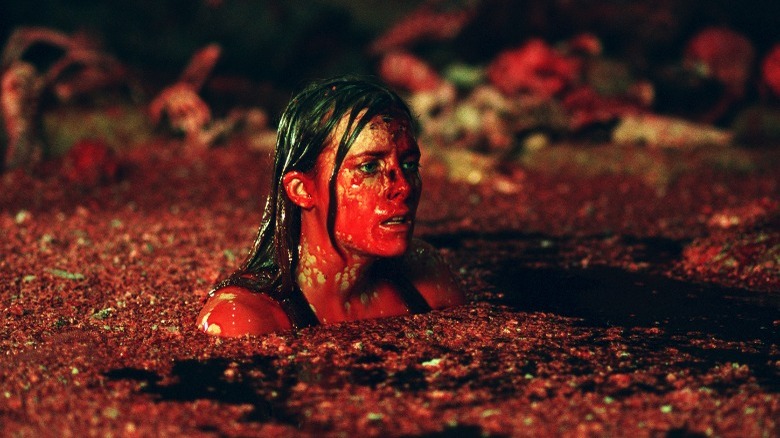 Woman in covered in blood in The Descent