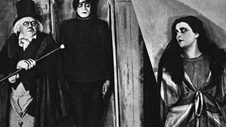 A woman hides from The Cabinet of Dr. Caligari 