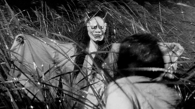 Woman in demon mask scares lady in Onibaba