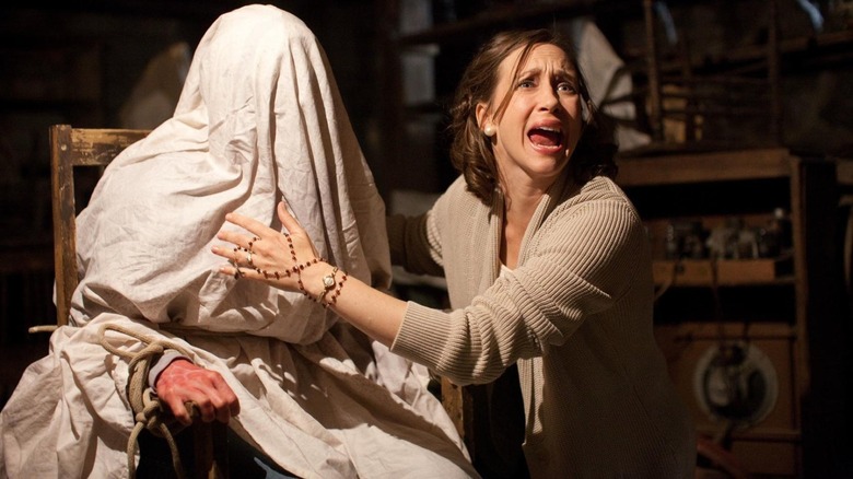 Woman conducts exorcism in The Conjuring