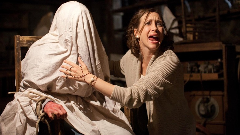 Woman conducts exorcism in The Conjuring