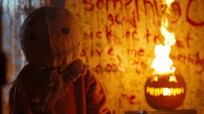 Sam lurks by jack o'lantern in Trick r' Treat