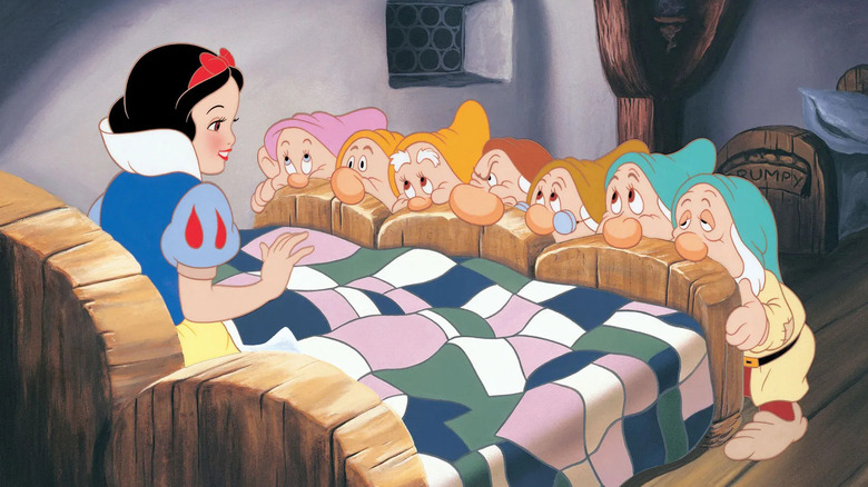 Snow White being woken up by the Seven Dwarfs in Snow White and the Seven Dwarfs