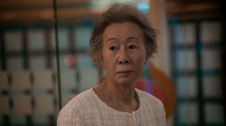 An older Kim Sunja (Youn Yuh-jung) looks pensively in Pachinko