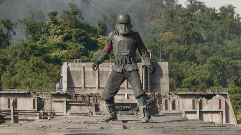 The Mandalorian's Din Djarin standing on an Imperial transport