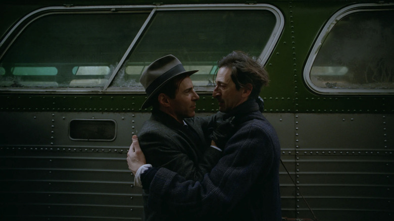 The Brutalist László Tóth and Attila hugging at the bus